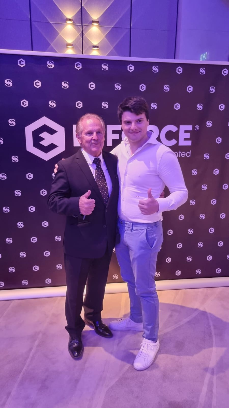 Giorgio Alessandro Donà-Danioni with a co-speaker at the Efforce Silent Unicorn event backdrop in Dubai