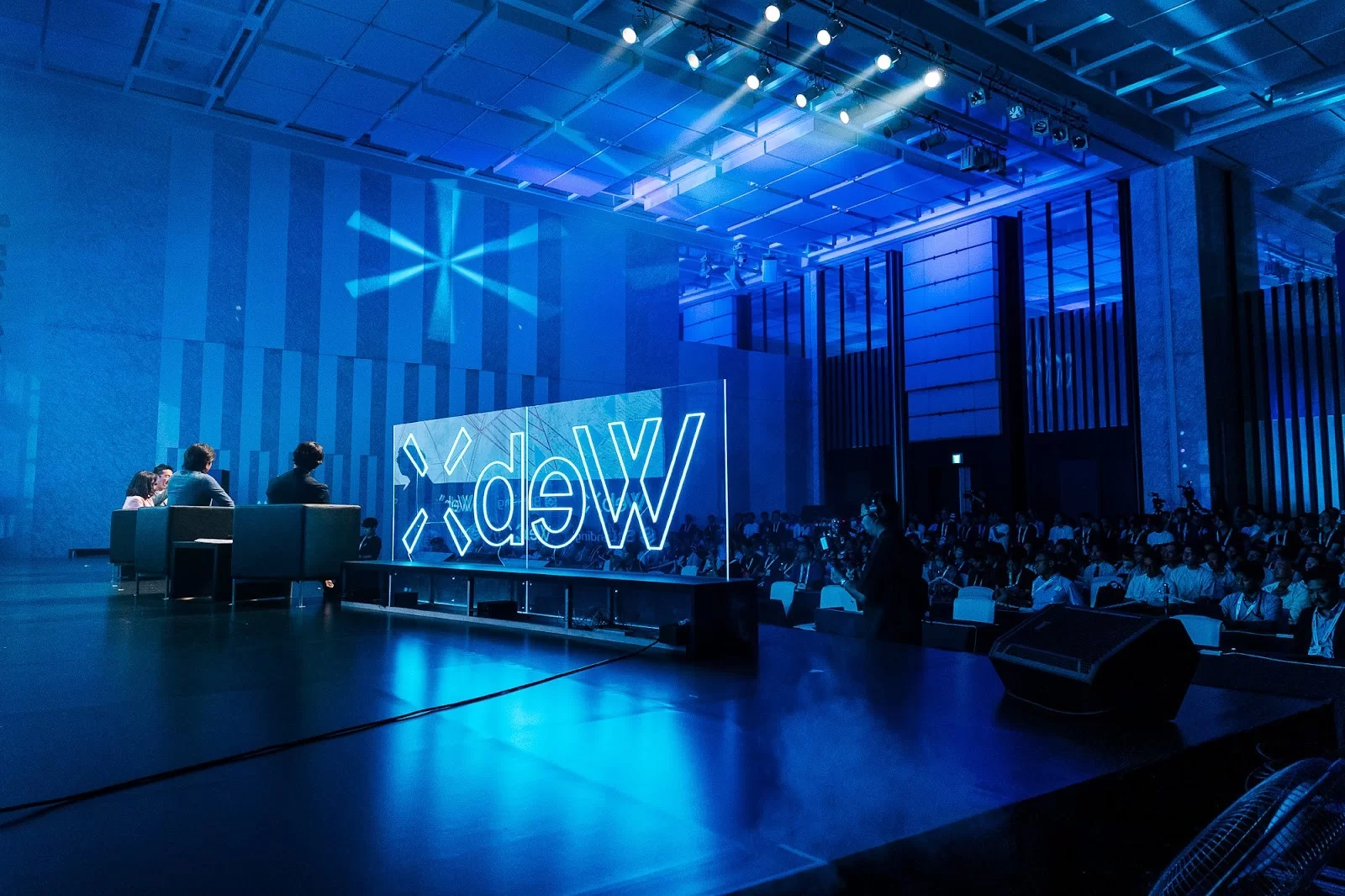 WebX Asia 2023 stage at the Tokyo International Forum, with the illuminated WebX logo screen and a packed audience